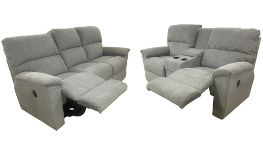 gray reclining sofa and loveseat on a white background