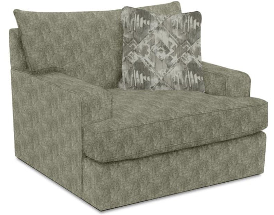 gray oversized chair substantial track arm and deep plush seat, accompanied by a decorative pillow.