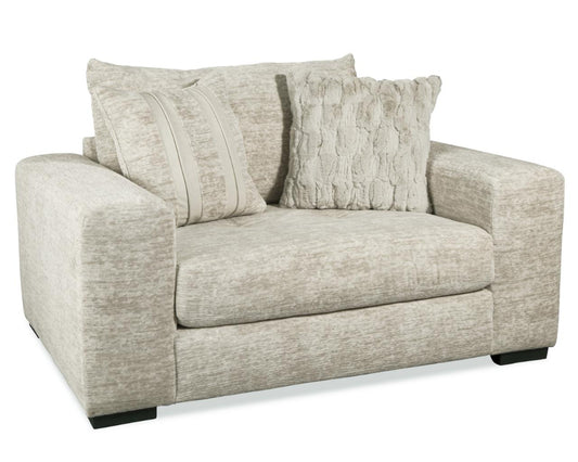 A beige fabric sofa with deep seats, wide track arms, and a relaxed backrest, presented in a studio setting.