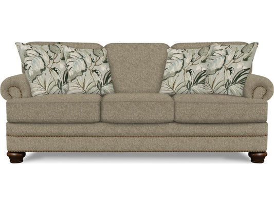 Beige sofa with floral-patterned cushions on a white background