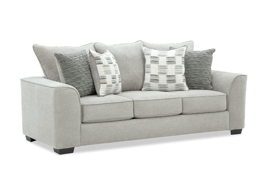Gray sofa with patterned cushions on a white background