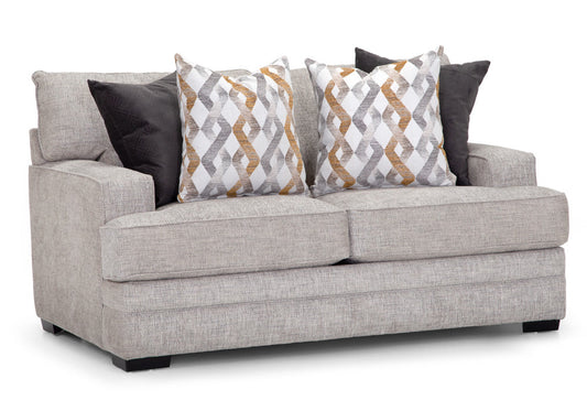 A beige upholstered loveseat with accent pillows featuring geometric patterns.