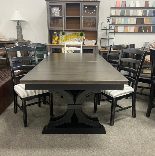Dining table with chairs in a room setting