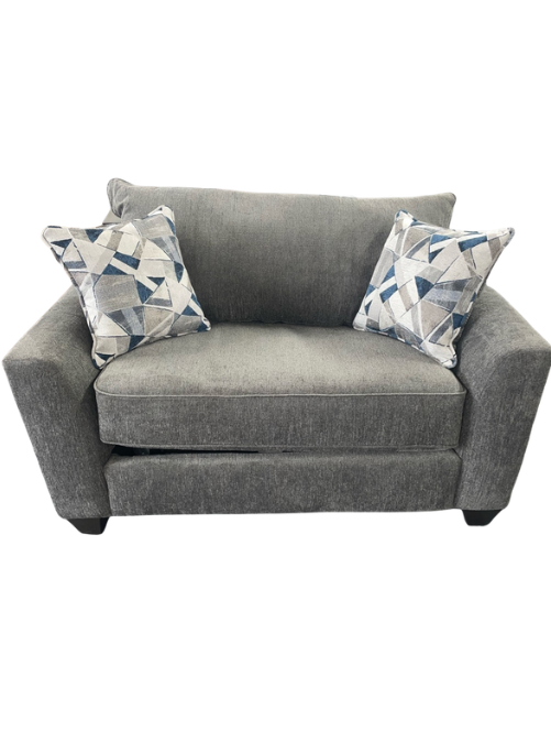 Gray sofa with two patterned cushions on a white background