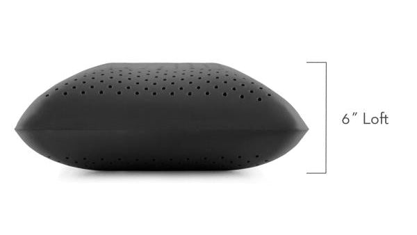 Black pillow with measurement label on a white background