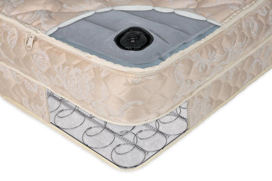 Close-up of a mattress with a visible coil spring structure and air bag system.