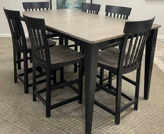 A set of Gathering Table with six chairs, featuring a wood top and black legs.