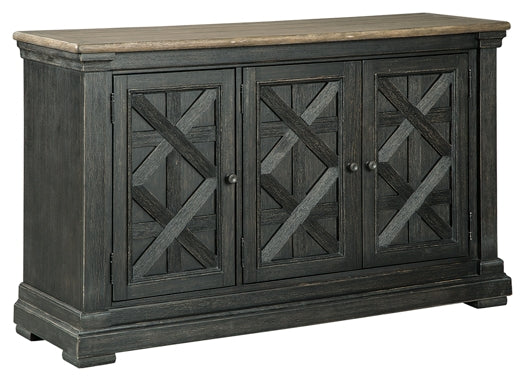 Dark wood sideboard with three doors on a white background