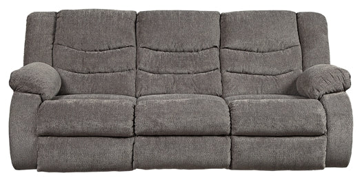 Gray sofa with reclining feature on a white background