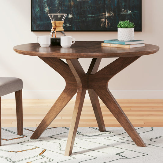Wooden dining table with chairs in a room setting