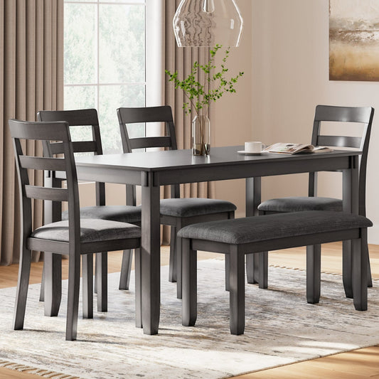 Dining room set with gray table and chairs on a rug