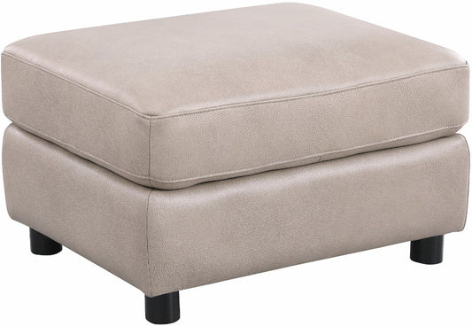 Beige ottoman with black legs on a white background