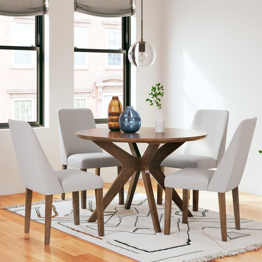 Dining room with wooden table and white chairs in a well-lit room.