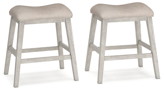 Two light gray bar stools with beige cushioned seats on a white background