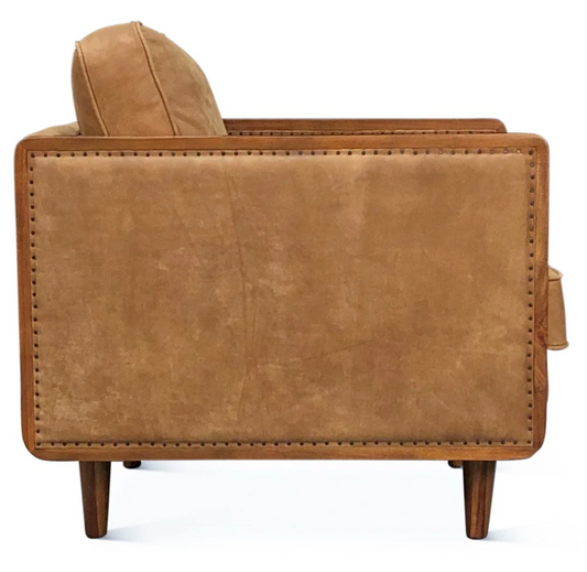 Brown leather armchair on a white background