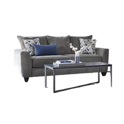 Gray sofa with decorative pillows and a coffee table on a white background