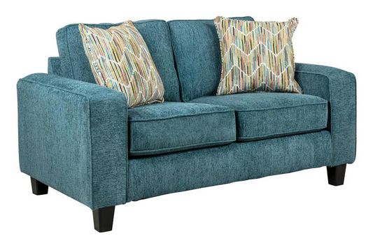teal loveseat with patterned cushions on a white background