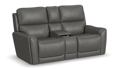 Gray leather reclining sofa with cup holders on a white background