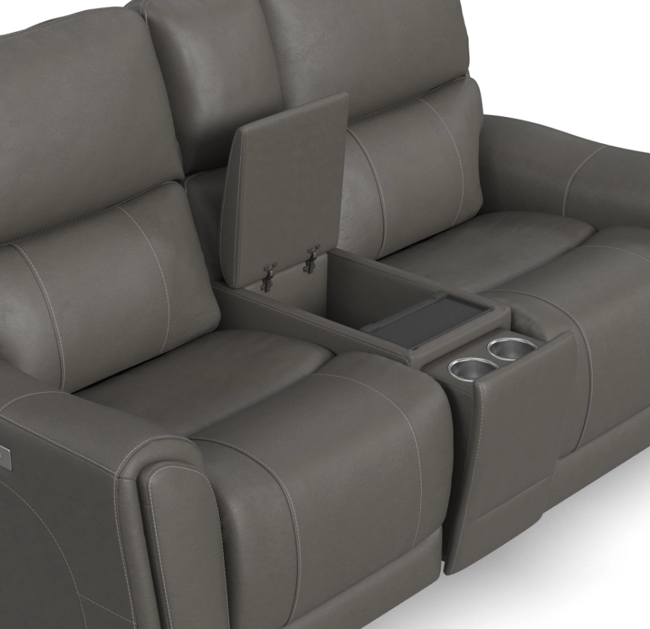 Gray leather sofa with cup holders and armrest storage on a white background