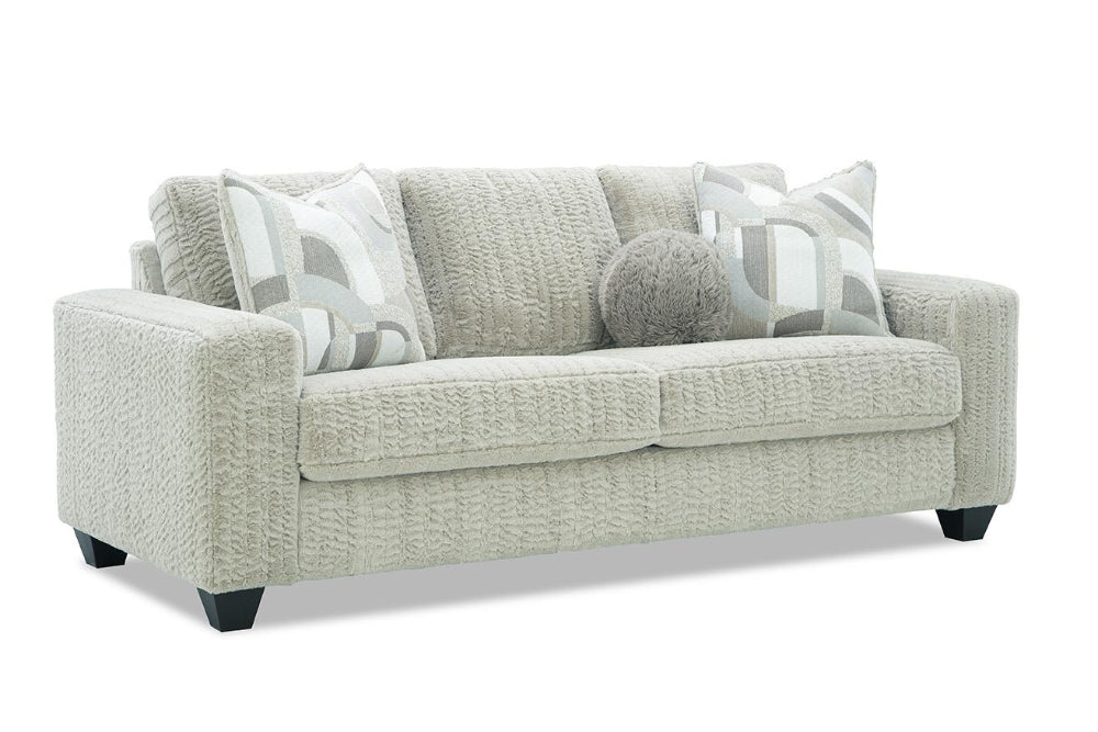 Gray sofa with patterned cushions on a white background