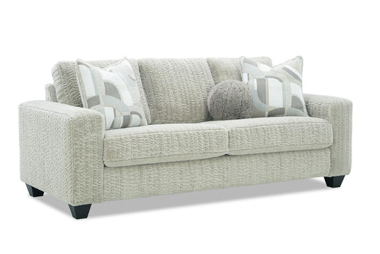 Gray sofa with patterned cushions on a white background