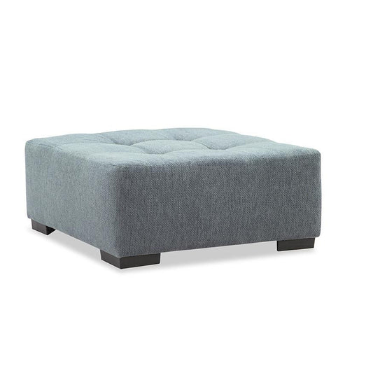 Gray upholstered ottoman on a white background