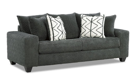 Gray sofa with patterned cushions on a white background