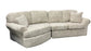Beige sectional sofa with cushions on a white background