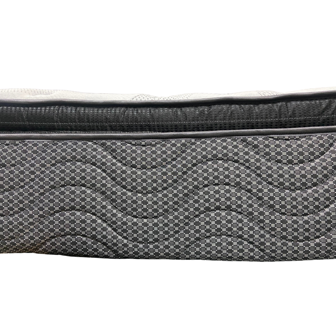 Close-up of a textured black and gray bag on a white background