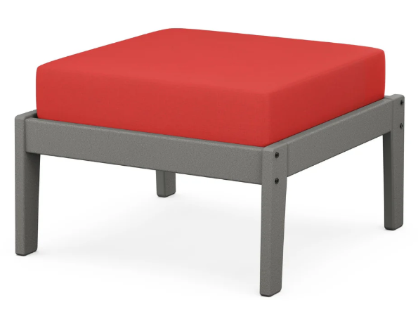A red cushioned deep seating ottoman with a gray frame, made from all-weather materials suitable for outdoor use.