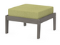 A green cushioned deep seating ottoman with a driftwood frame, made from all-weather materials suitable for outdoor use.