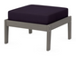 A dark blue cushioned deep seating ottoman with a driftwood frame, made from all-weather materials suitable for outdoor use.