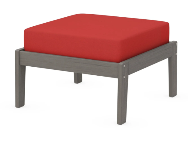 A red cushioned deep seating ottoman with a driftwood frame, made from all-weather materials suitable for outdoor use.