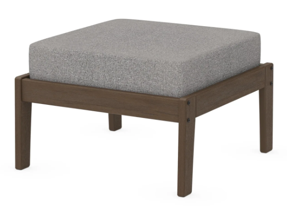 A gray cushioned deep seating ottoman with a kona frame, made from all-weather materials suitable for outdoor use.