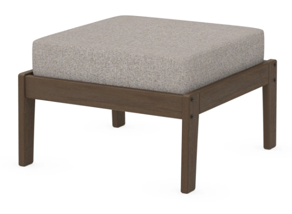 A gray cushioned deep seating ottoman with a kona frame, made from all-weather materials suitable for outdoor use.