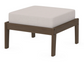 A cream cushioned deep seating ottoman with a kona frame, made from all-weather materials suitable for outdoor use.