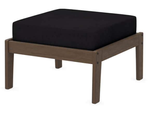 A dark blue cushioned deep seating ottoman with a kona frame, made from all-weather materials suitable for outdoor use.