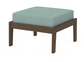 A light blue cushioned deep seating ottoman with a kona frame, made from all-weather materials suitable for outdoor use.