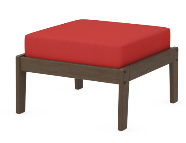 A red cushioned deep seating ottoman with a kona frame, made from all-weather materials suitable for outdoor use.