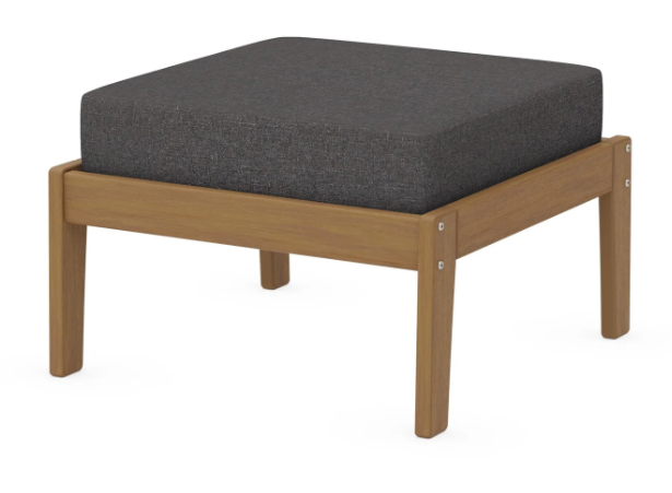 A dark gray cushioned deep seating ottoman with a natural frame, made from all-weather materials suitable for outdoor use.