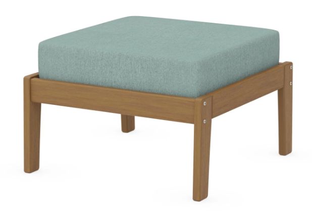 A light blue cushioned deep seating ottoman with a natural frame, made from all-weather materials suitable for outdoor use.