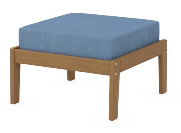 A blue cushioned deep seating ottoman with a natural frame, made from all-weather materials suitable for outdoor use.