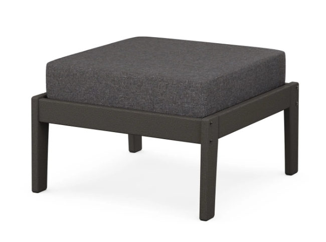 A dark gray cushioned deep seating ottoman with a vintage coffee frame, made from all-weather materials suitable for outdoor use.