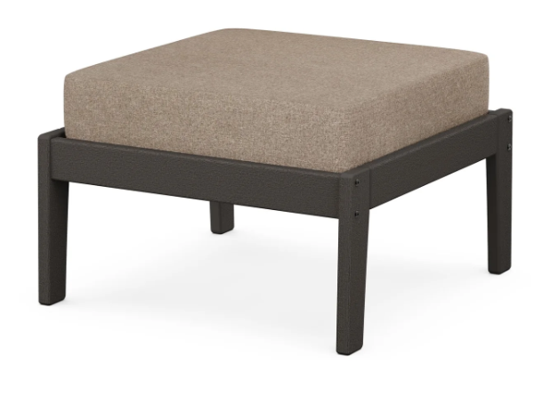 A beige cushioned deep seating ottoman with a vintage coffee frame, made from all-weather materials suitable for outdoor use.