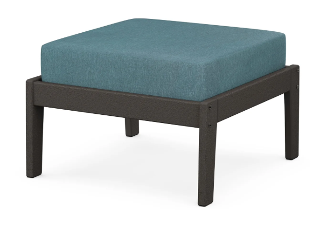 A teal cushioned deep seating ottoman with a vintage coffee frame, made from all-weather materials suitable for outdoor use.