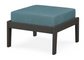 A teal cushioned deep seating ottoman with a vintage coffee frame, made from all-weather materials suitable for outdoor use.
