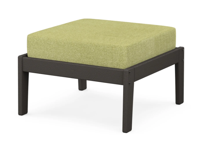 A green cushioned deep seating ottoman with a vintage coffee frame, made from all-weather materials suitable for outdoor use.