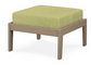 A green cushioned deep seating ottoman with a vintage sahara frame, made from all-weather materials suitable for outdoor use.
