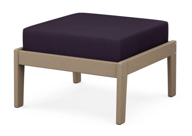 A dark blue cushioned deep seating ottoman with a vintage sahara frame, made from all-weather materials suitable for outdoor use.