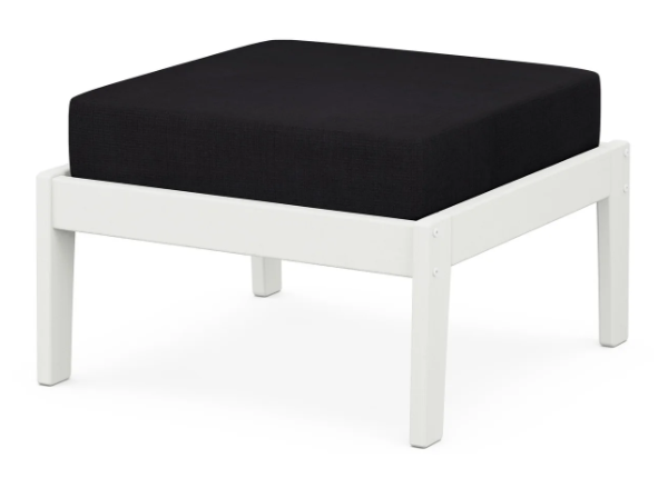 A dark blue cushioned deep seating ottoman with a vintage white frame, made from all-weather materials suitable for outdoor use.